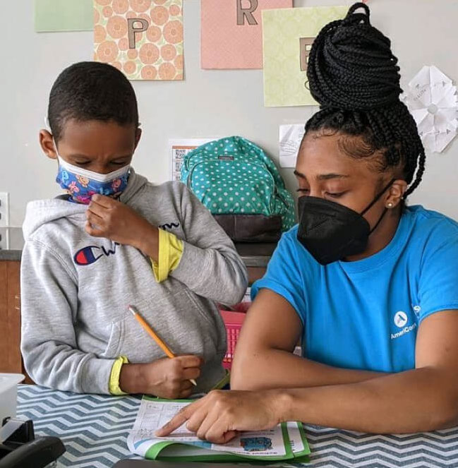 volunteer reading with child