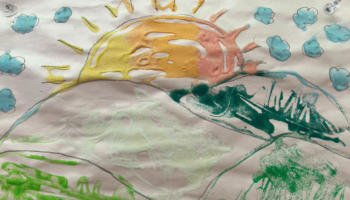 A drawing of the sun over hills