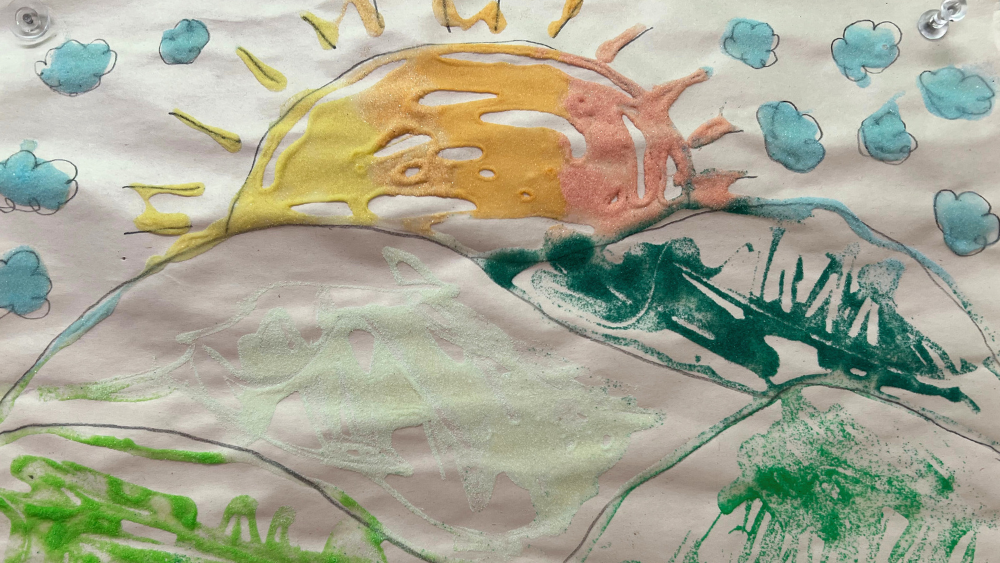 A drawing of the sun over hills