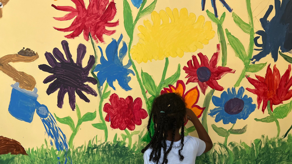 FY26 Website Blog Post Featured Images (7) Student working on a mural