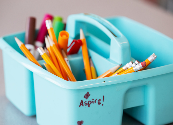 A pencil box with "Aspire" written on it