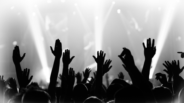 Hands raised at a concert