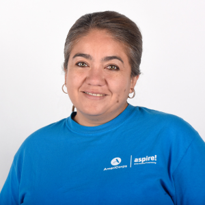 Website Testimonial Headshots A woman in a blue Aspire AmeriCorps t-shirt