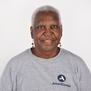 Website Testimonial Headshots(2) A woman in a gray AmeriCorps t-shirt