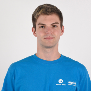 Website Testimonial Headshots(3) A man in a blue Aspire AmeriCorps t-shirt