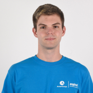 A man in a blue Aspire AmeriCorps t-shirt